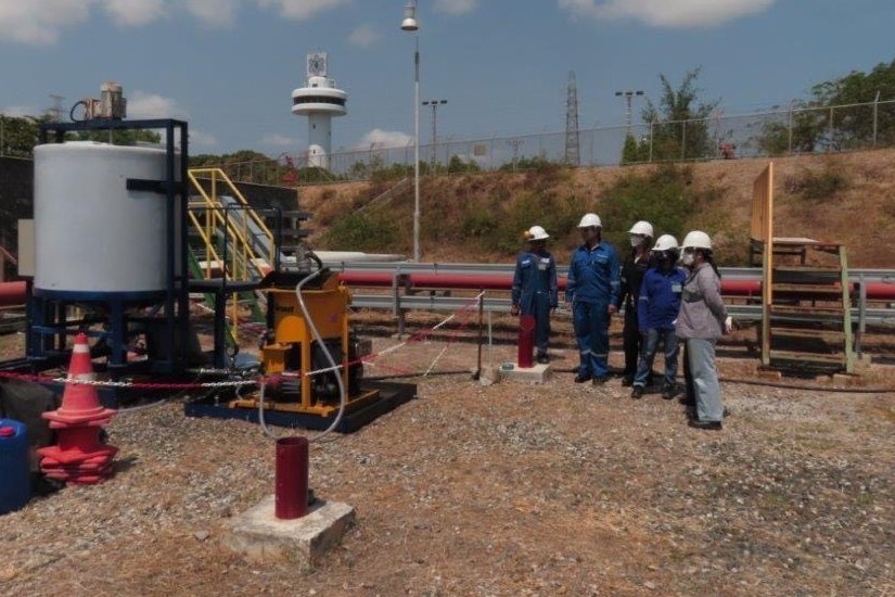 Team inspecting a pollution treatment system at an industrial site